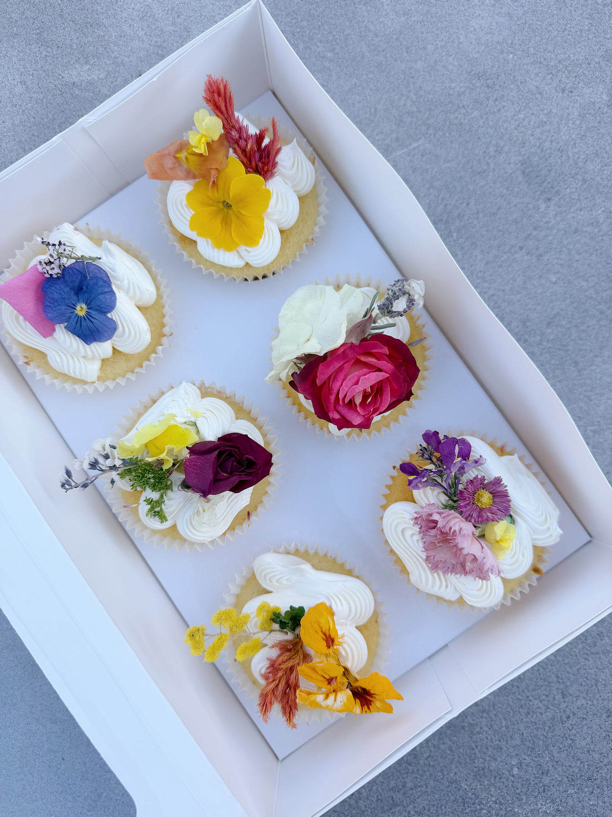 Set of 6 cupcakes decorated with the Whimsical Wildflowers collection.
