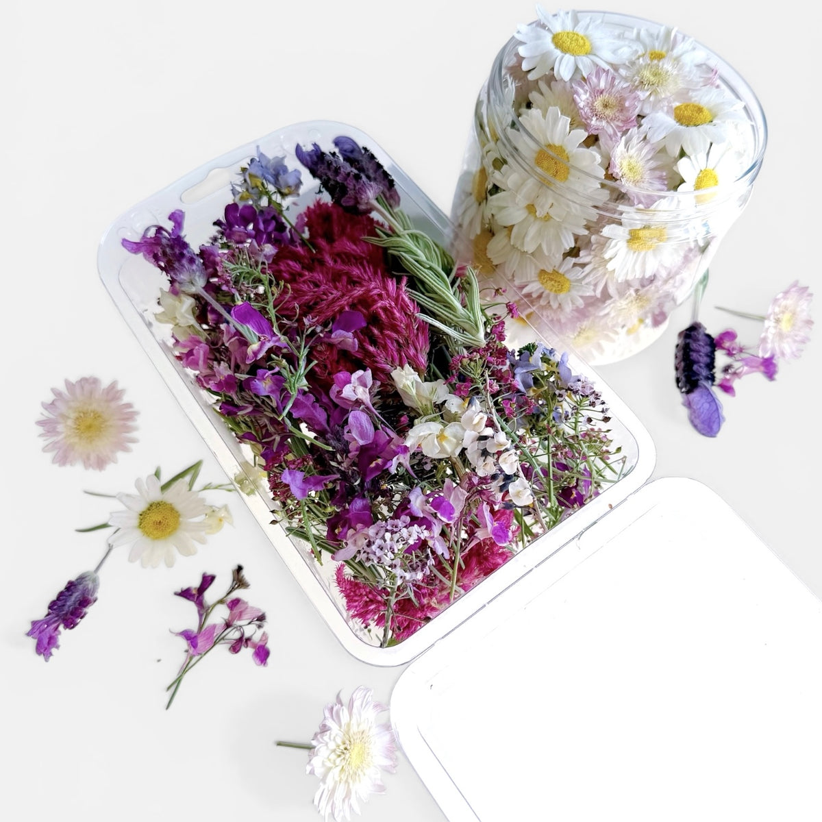 2 packs of pastel coloured freeze dried edible flowers.
