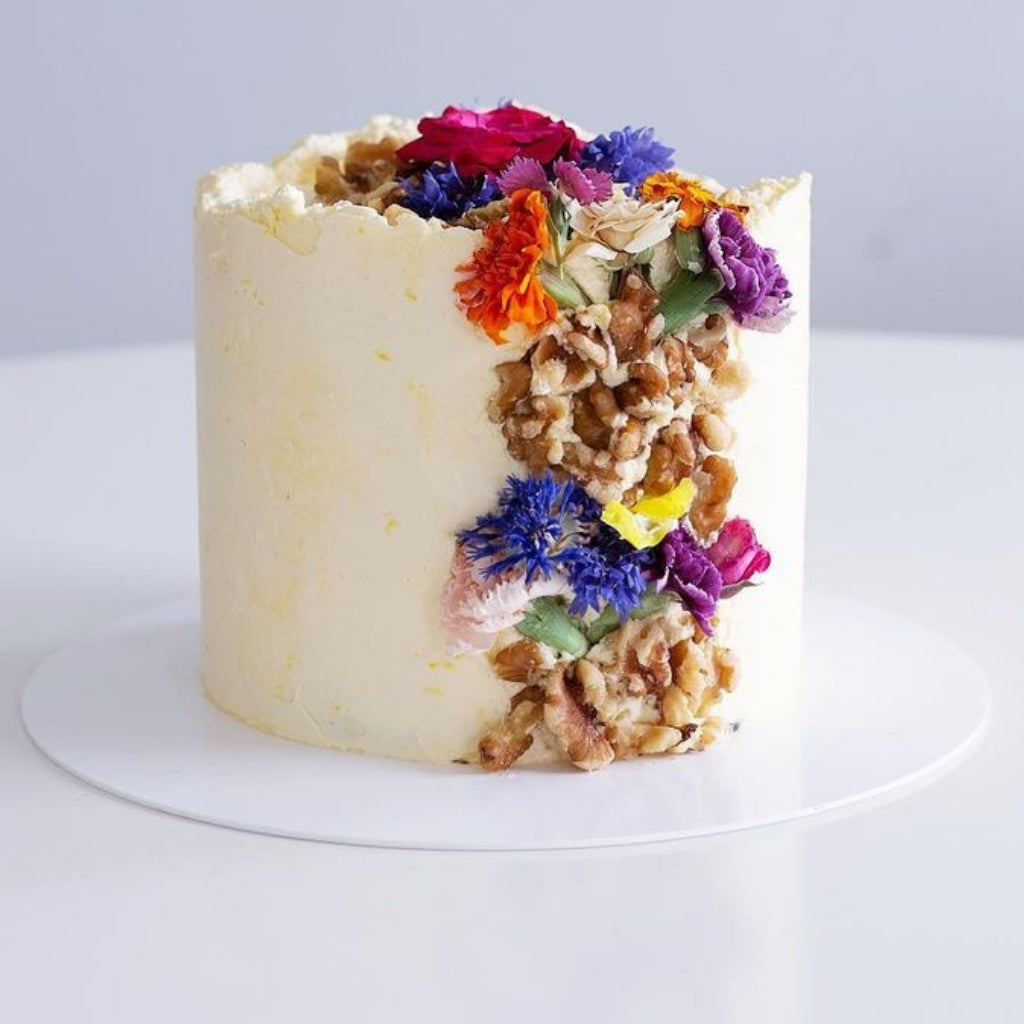 Magnolia Kitchen carrot cake decorated with Bloomish freeze dried edible carnations.