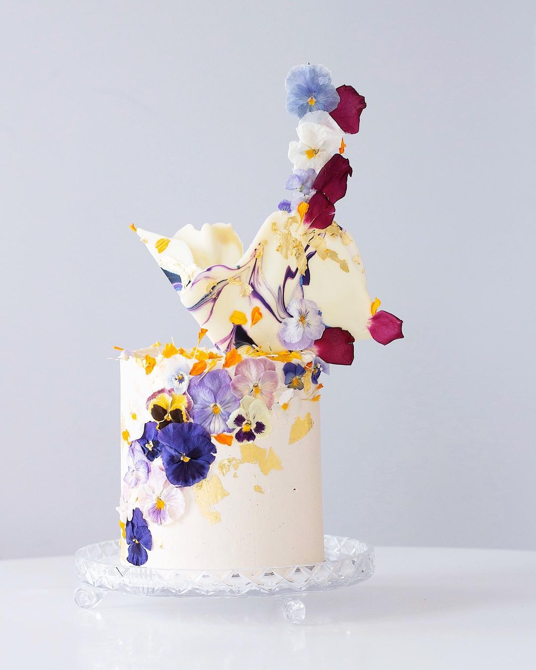 Magnolia Kitchen&#39;s signature chocolate cake embellished with our freeze dried edible pansies.